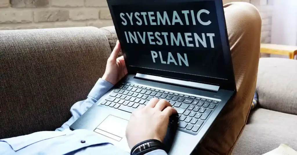 Person using laptop for investment planning FD vs SIP